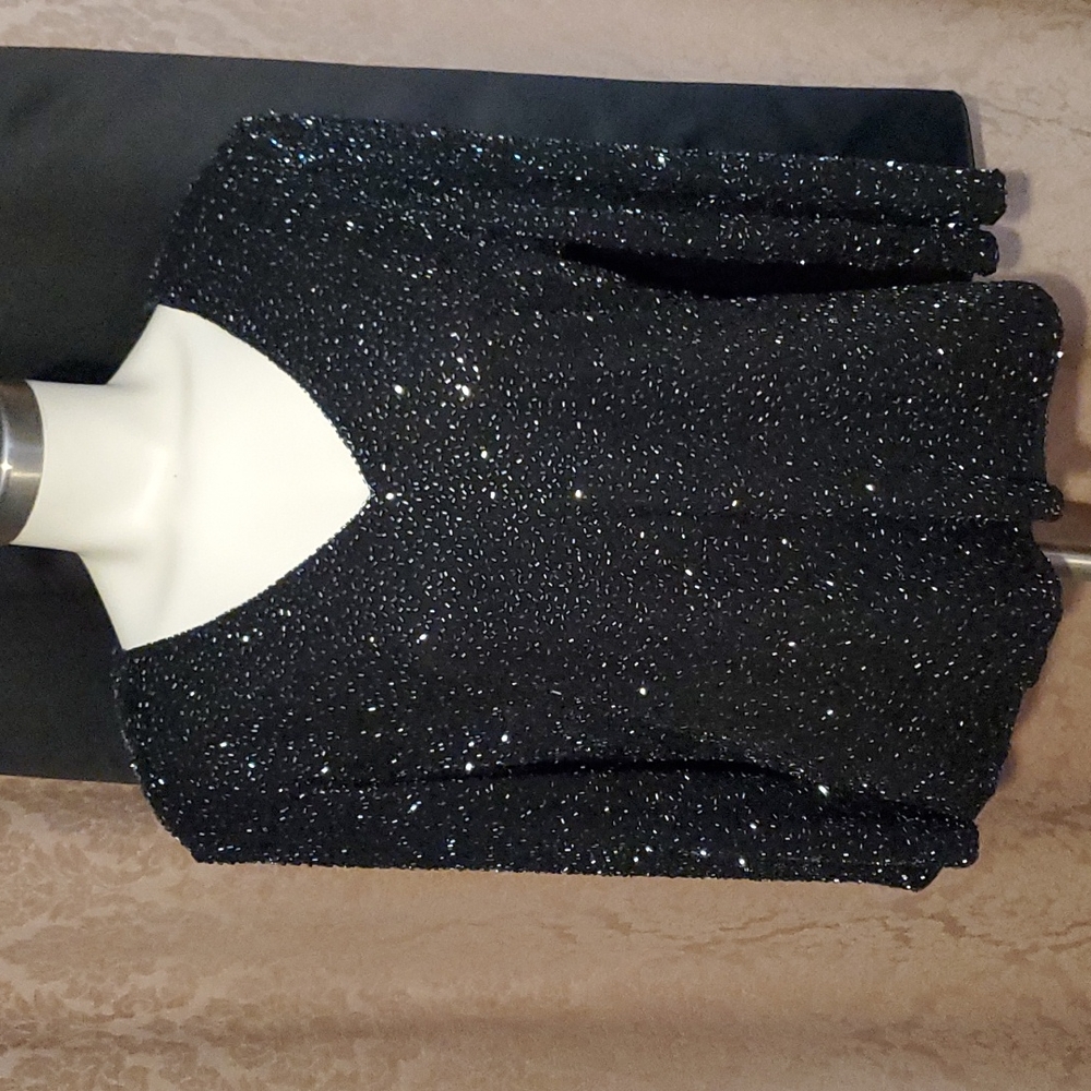 Beautiful long skirt and embellished  black top with small shoulder pads.